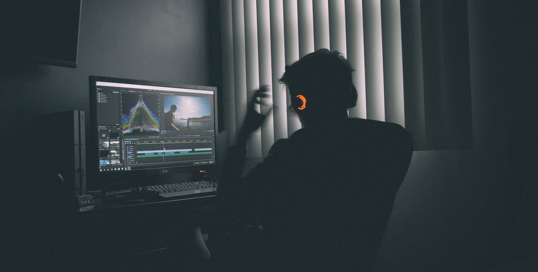 A person reviewing video at a computer.
